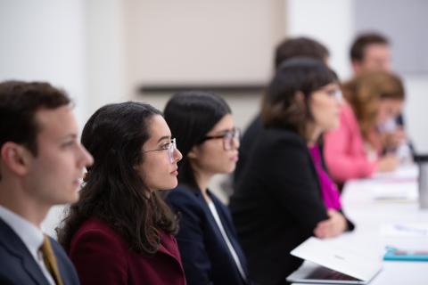 students in classroom in business professional wear