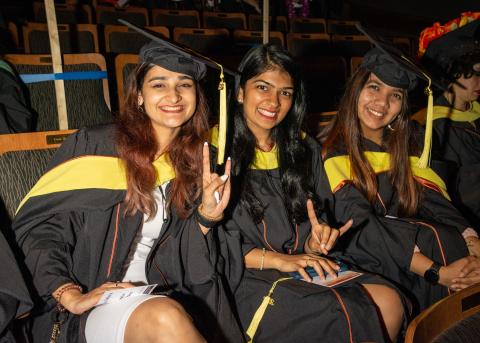 Three students at convocation