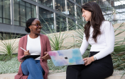 two students outside talking