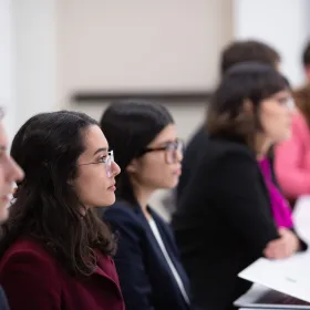 students in classroom in business professional wear