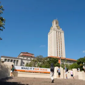 Tower building with students walking