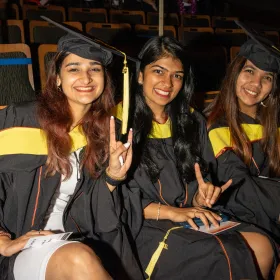 Three students at convocation