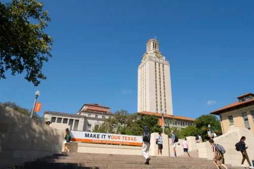 Tower building with students walking