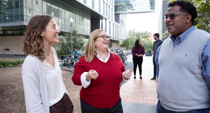 faculty talking with student