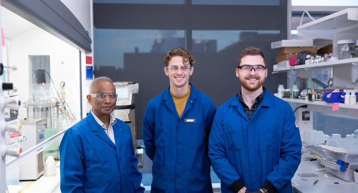 students and professor in lab