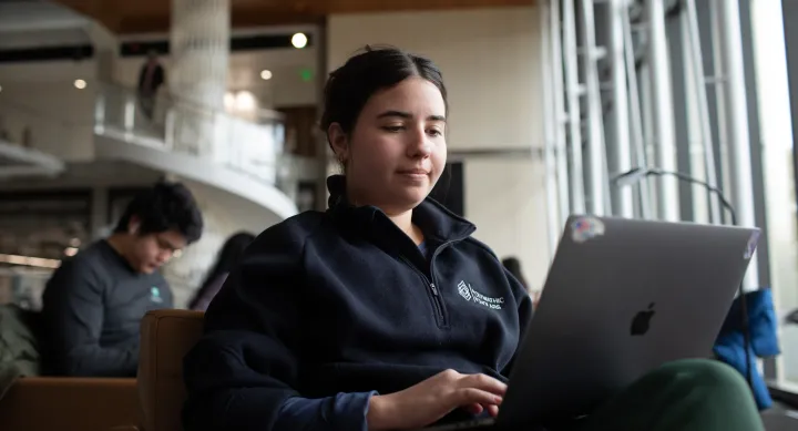 student looking at laptop