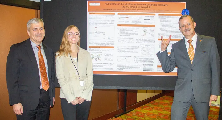 Kimber Long next to her award-winning poster with Dean Sam Poloyac and Associate Dean John Richburg at Research Day 2023.
