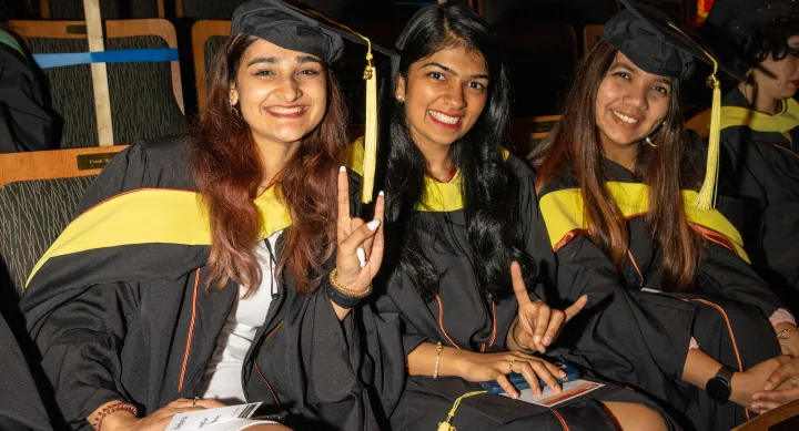 Three students at convocation