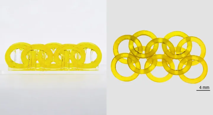 Two sets of golden interlocking rings. One of them is five rings linked in a chain shape, the other is 10 rings interlocked in a chain in sets of two.