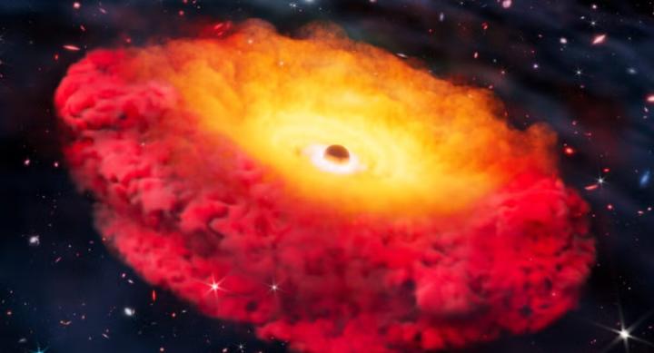 An orange and red black hole in space.