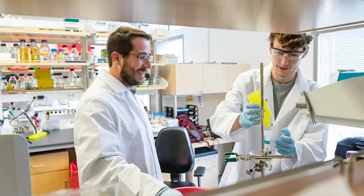 Professor and grad student in lab