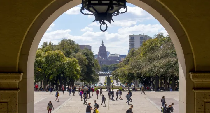 Students and Capitol through Main Building arch