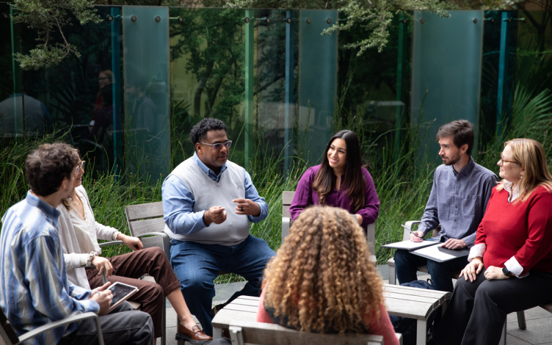 professor talking with students outside